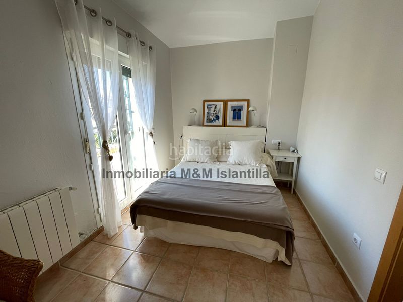 Foto e43b1932-b91a-49aa-8aee-7dd1a2416cfc. Casa adossada amb piscina a Islantilla golf Islantilla