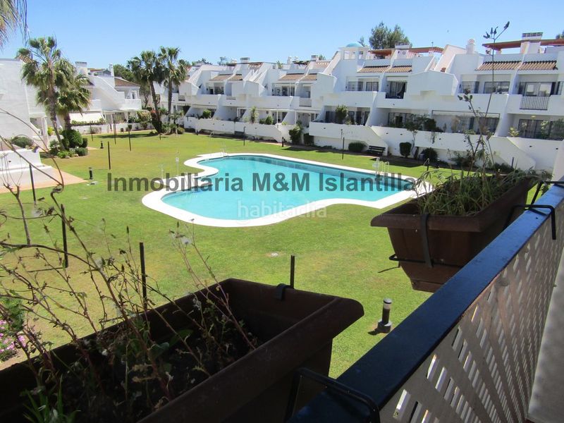 Foto c4da6a42-da22-43db-a1ef-ffe4b15f34ee. Àtic amb xemeneia aparcament piscina a Islantilla golf Islantilla