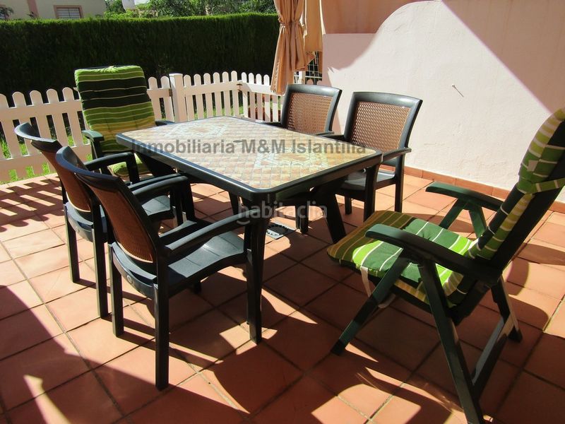 Foto f0930732-cfde-479b-81a9-00c0a2e42324. Casa adossada amb aparcament piscina a Islantilla golf Islantilla