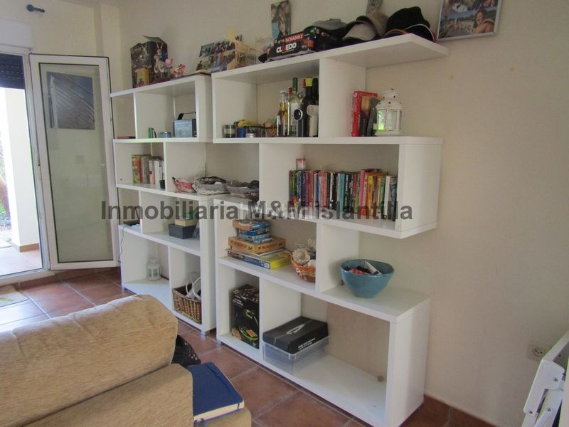 Foto 4d737a90-ea0a-4d4f-8095-1dff4210a40b. Casa adossada amb aparcament piscina a Islantilla golf Islantilla