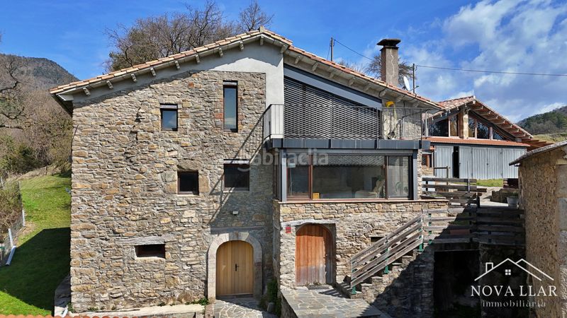 Foto f7c624d5-f12c-4f2a-bfff-2423515faf59. Casale con camino riscaldamento parcheggio in Llosses (Les)