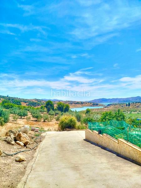 Foto b7349aba-f4fd-4ef4-865e-0f6be7f27c0e. Finca rústica terreno urbano en primera línea con vistas al pantano de la viñuela en Periana
