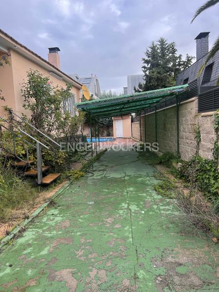 Foto f1080b2b-4fdc-442f-bf75-d4dbd56eed0a. Casa con riscaldamento parcheggio piscina in Pueblo Pozuelo de Alarcón