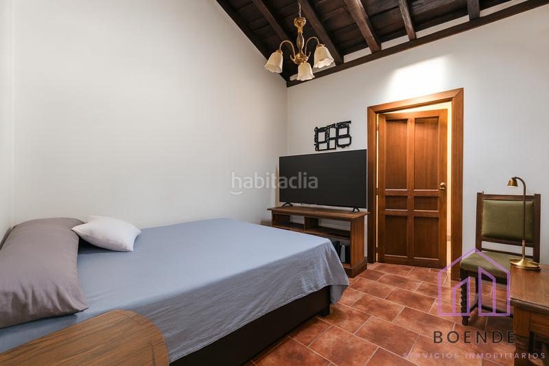 Foto a19db476-05e3-4e17-8a8f-ac86c7dbbc78. Casa a schiera con camino in Chinchón