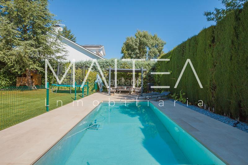 Foto 68f3507a-8724-483d-8012-8d3a5d310046. Casa aparellada amb xemeneia calefacció aparcament piscina a Galapagar