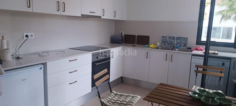 Foto dd4c4d01-2a5f-4b10-85f5-975b8c2fd790. Casa adossada amb calefacció aparcament piscina a Es Mercadal