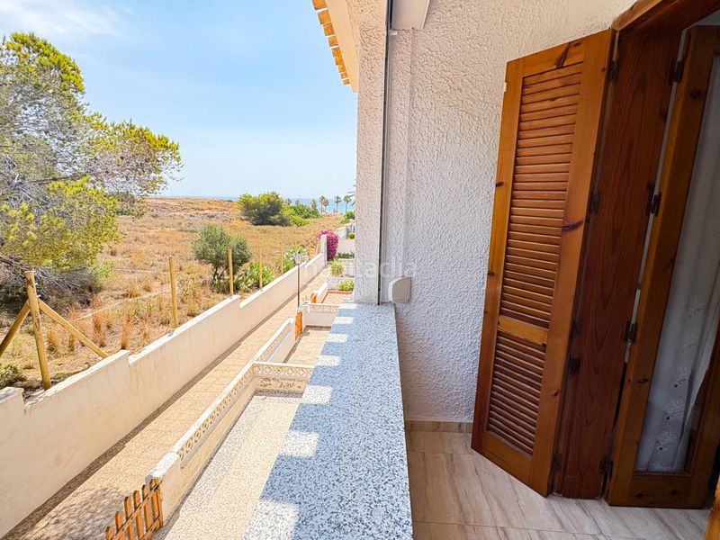 Foto 40b82819-8673-4cef-b50e-5119c51c9da7. Casa adossada amb calefacció aparcament a Playa Flamenca Orihuela
