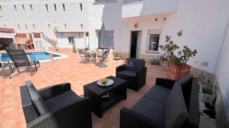 Foto 71ddc92d-28a5-429f-a594-49436fb9478c. Casa aparellada amb calefacció aparcament piscina a Torrox