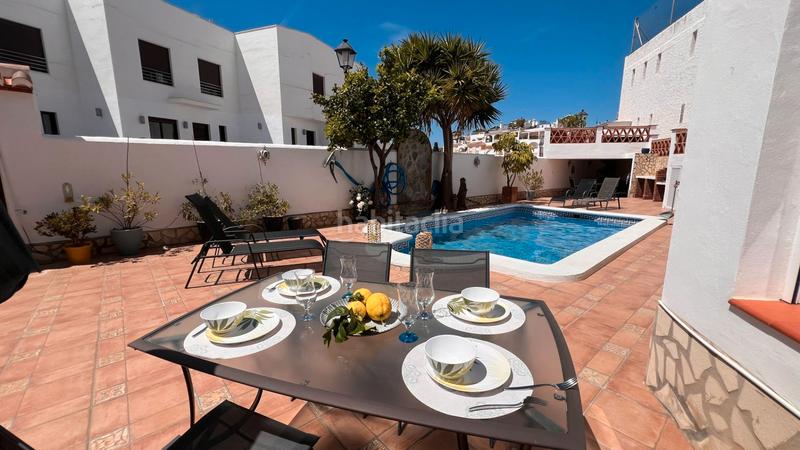 Foto 7ad5ee4a-9f7b-4005-852f-95d8527fa383. Doppelhaus mit heizung parking pool in El Peñoncillo Torrox