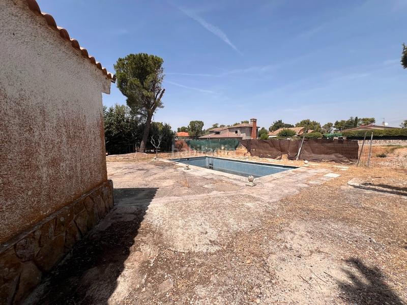 Foto f6f7c4f0-a3f6-4424-b925-2cf4ab96babc. Chalet  independiente en Eurovillas con piscina en Nuevo Baztán