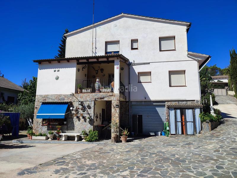 Foto dd0260fb-892b-45dd-9a89-4ed54e7a4409. Casa amb xemeneia aparcament piscina a Aiguaviva Parc Vidreres