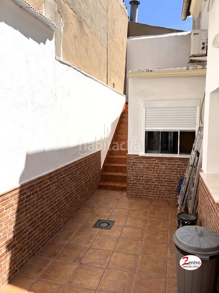 Foto c830b7f6-7618-47a1-8d0d-f0e0e8c459ec. Casa a schiera con camino in Alcázar de San Juan