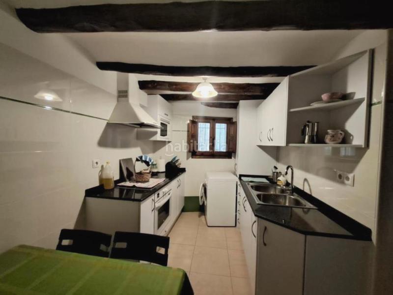 Foto 192d14de-d8bd-4f53-ace0-7f5e2f01c383. Casa aparellada amb xemeneia a Peñarroya de Tastavins