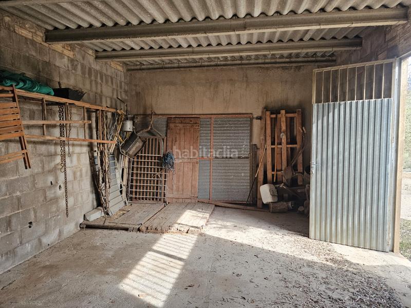 Foto 6e7e91bf-11fa-4180-84ec-9e41df88b5d0. Finca rústica terreno agrícola con una pequeña casa en Roquetes