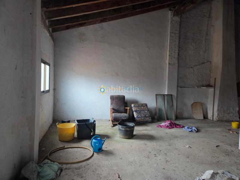 Foto 16edf015-d982-4da3-b3c4-79a56501471a. Casa aparellada amb xemeneia a Alcàntera de Xúquer