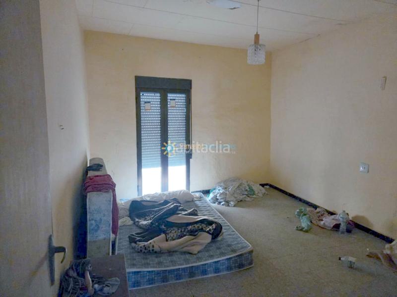 Foto 32314b99-4cac-4eba-876b-5794e53876f2. Casa aparellada amb xemeneia a Alcàntera de Xúquer