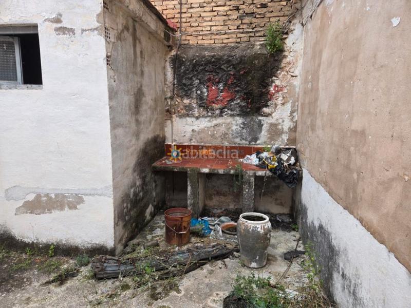 Foto 46bc3a8b-126c-422e-88f4-8bbfe822521a. Casa aparellada amb xemeneia a Alcàntera de Xúquer