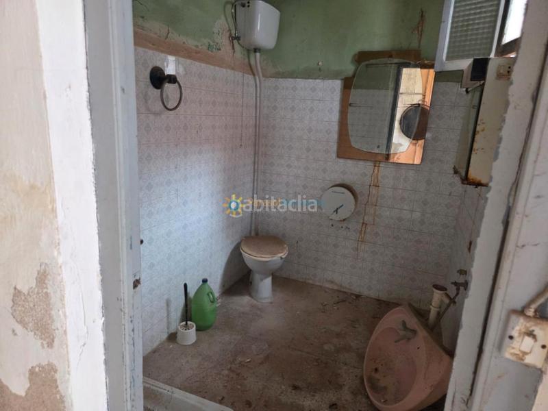 Foto 4dcd8c13-41ff-4aa5-bbb7-82183f9aeb2f. Casa aparellada amb xemeneia a Alcàntera de Xúquer