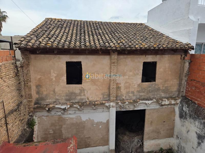 Foto 6615f2dd-c644-47e0-ac93-608e5ef5eb1a. Casa aparellada amb xemeneia a Alcàntera de Xúquer