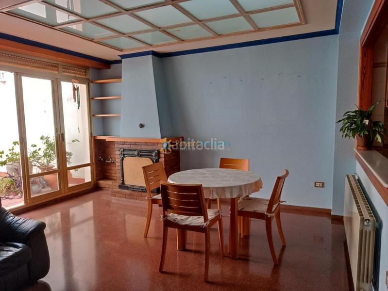 Foto 124ef1ea-bd4f-450f-a0a1-1d43c3642e22. Casa aparellada amb xemeneia calefacció aparcament a Oliva