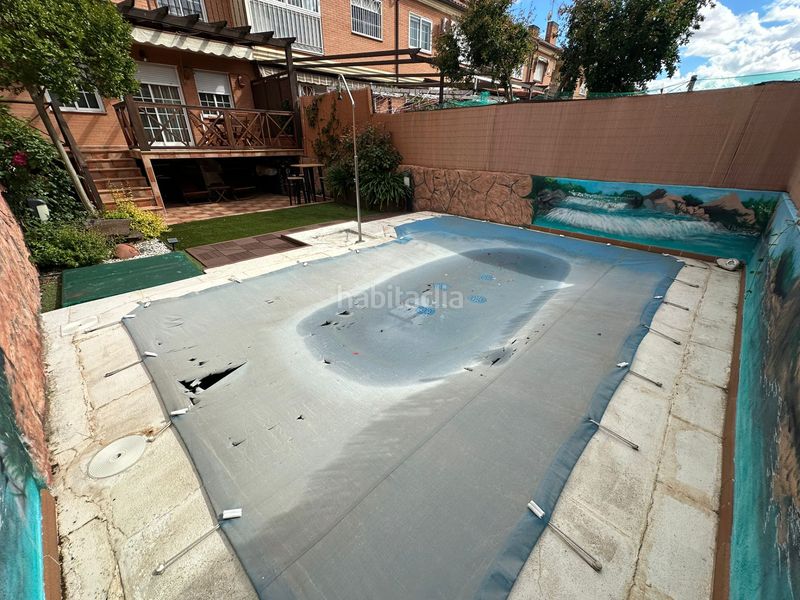 Foto c21d7a41-4b84-4587-a0d0-ce71d24be594. Casa adossada amb calefacció aparcament piscina a Parla