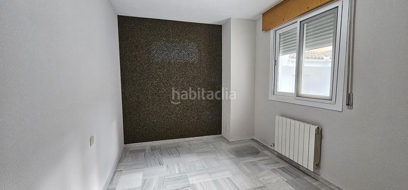 Foto c364bada-44cd-403d-9539-5f674c8b9ffa. Casa adossada amb calefacció aparcament a Maracena