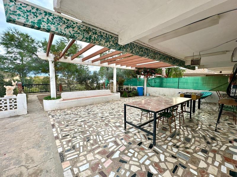 Foto 3d75a4f4-8b2f-47e9-a942-5eda4e14a14c. Casa adossada amb aparcament a Pueblo Acantilado-Lanuza Campello (el)