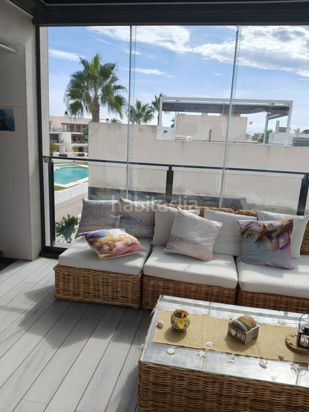 Foto 9c9bf39d-9c57-4ee9-9645-0168c274b935. Semi detached house in Campoamor Orihuela