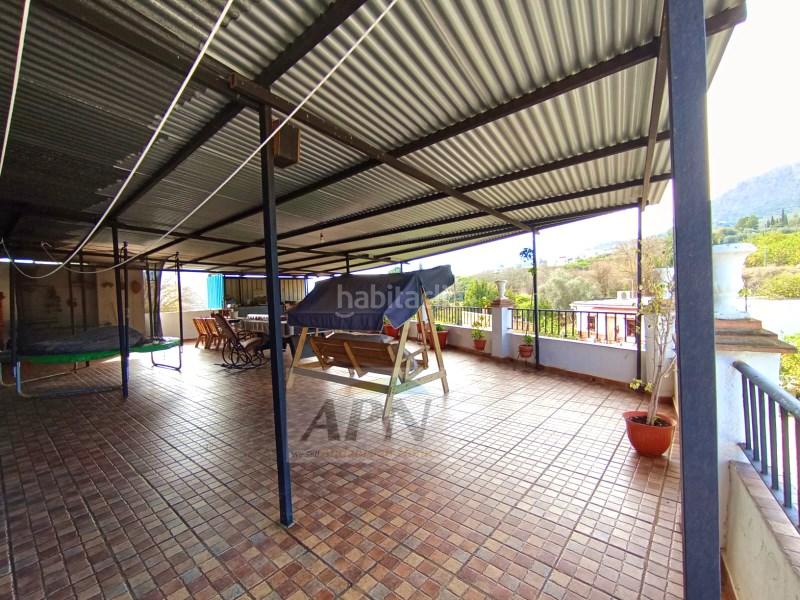 Foto 17589177-bbfc-4218-991d-54935d7ff932. Casa adossada a Álora