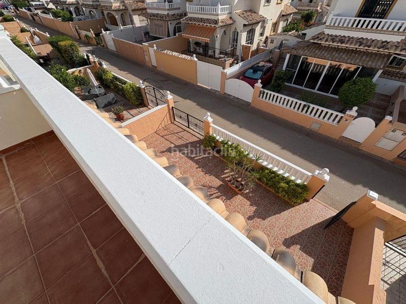 Foto c46ea0c1-449f-4942-b7e1-711ebdd1ada3. Casa pareada adosado duplex con gran terraza jardín y piscina en lomas de cabo roig, costa en Orihuela