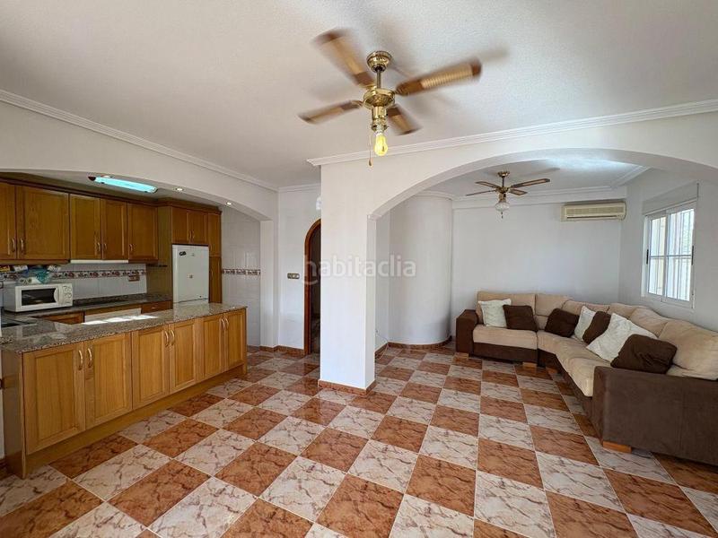 Foto f6717326-1c5a-46a7-8270-08645efcf60d. Casa pareada adosado duplex con gran terraza jardín y piscina en lomas de cabo roig, costa en Orihuela