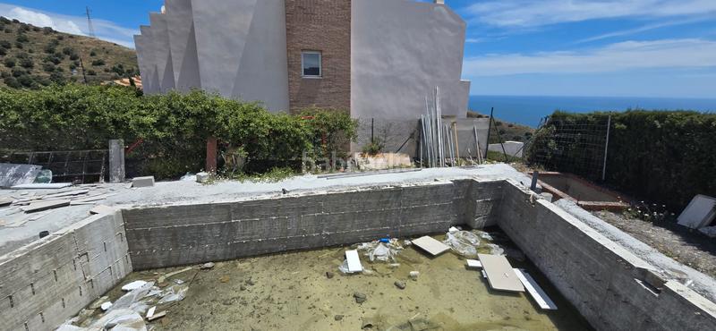 Foto fbc965d4-99f8-4e2b-8121-0b034c559585. Casa adosada en n/a adosados en venta costa ( El Peñoncillo) 2 dormitorios, piscina y garaje en Torrox