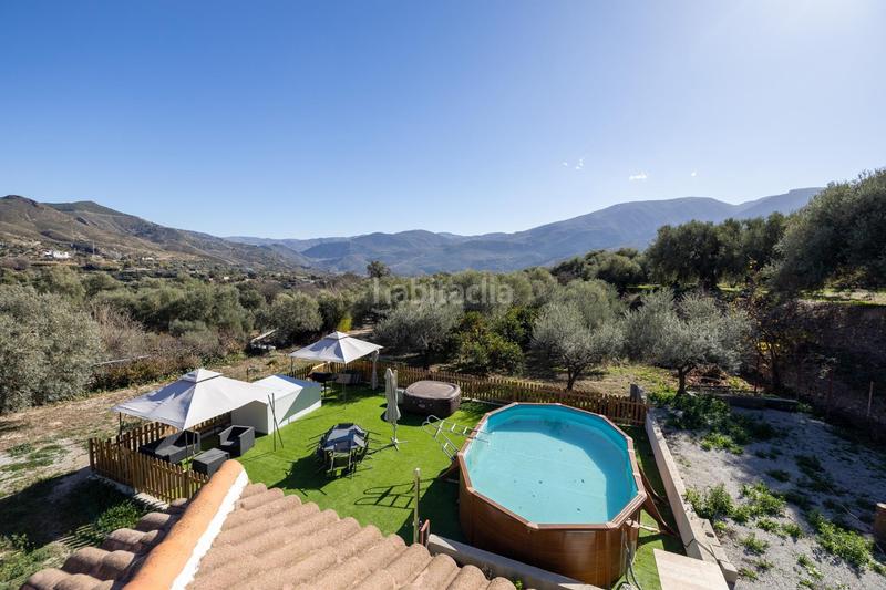 Foto b41e08e7-91fb-4582-b64e-3621796f859b. Chalet en carretera sortes 756 chalet con gran terreno en orgiva en Órgiva