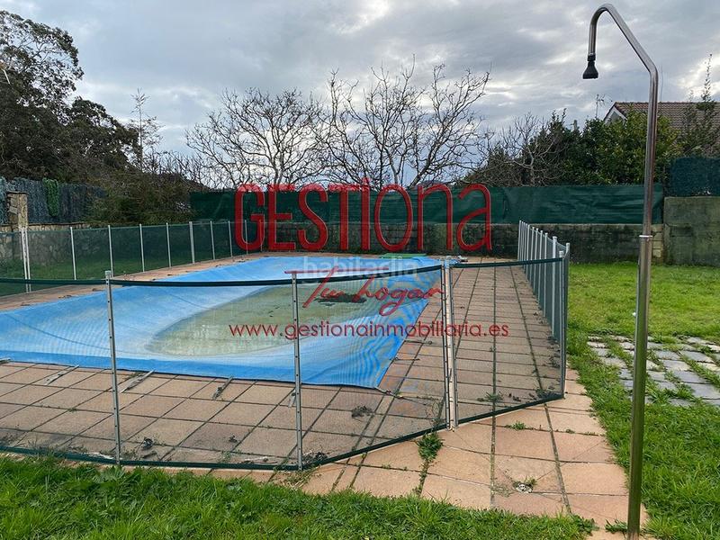 Foto da797e88-2569-4925-88a6-f1f5f28e4024. Casa pareada impresionante pareado con piscina en Ajo en Bareyo