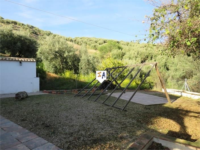 Foto 4b7f5613-d6c9-484c-84b4-56b8e1d476dc. Masia amb aparcament a Martos