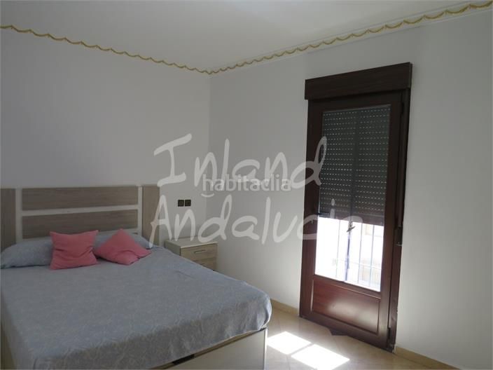Foto dbc5245d-65f9-420b-a854-05c2d46e7551. Casa adosada en Martos