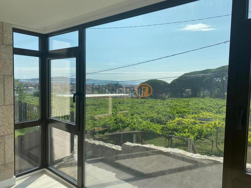 Foto bfa15d78-6150-423b-aaf0-f7306cdeec60. Chalet con riscaldamento parcheggio in Cambados