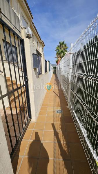 Foto 55cc959a-b839-4c55-9b23-733562b0ae88. Casa adosada amplio adosado en urbanización, ideal para familias en Polop