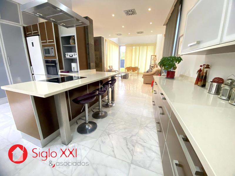 Foto a6a7309f-a0d7-4fb6-9136-ef565f6c8384. Chalet avec chauffage parking piscine dans Playa Burriana