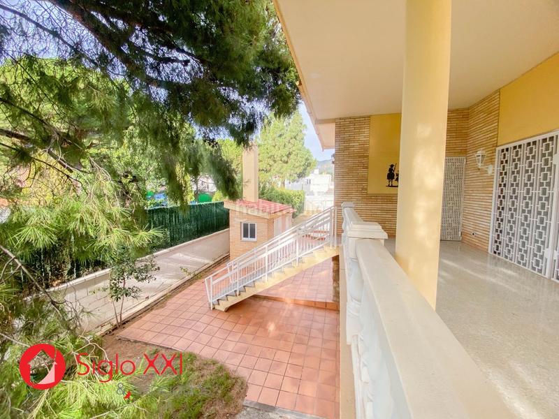 Foto 4b8abb12-81ad-4eef-836d-130890d70613. Chalet descubre la majestuosidad de este chalet excepcional, situado en una parcela de 1844 m2 que se presenta como un verdadero paraíso. en Benicasim / Benicàssim