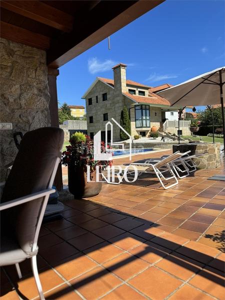 Foto 48074d62-cd30-4687-89d3-0b1f8551cbd9. Chalet with fireplace parking pool in Poio