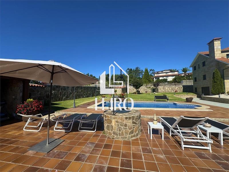 Foto ebcc6eff-6528-4ad9-b657-19af22aabc12. Chalet with fireplace parking pool in Poio