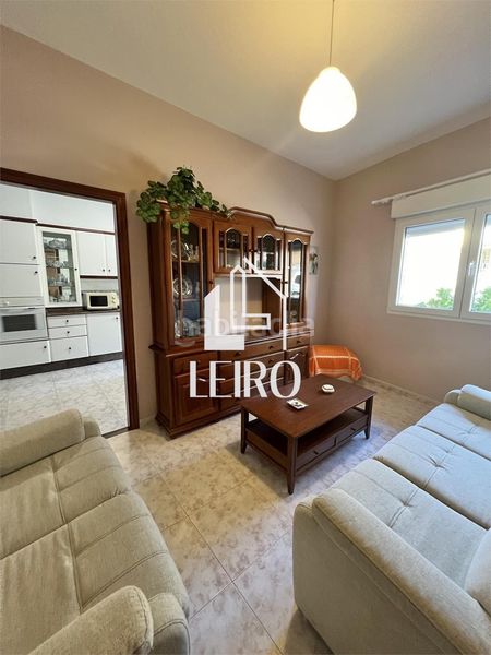 Foto 43a7aa98-5d3a-41fd-a48d-a82d2c4a2c56. Maison avec cheminée dans Boiro