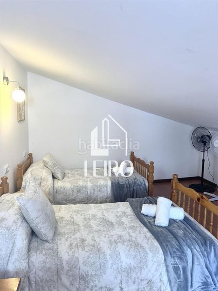 Foto a82f61f7-bf35-421b-acb7-a3ab5bee3a96. Casa amb xemeneia calefacció a Adina - Portonovo Sanxenxo