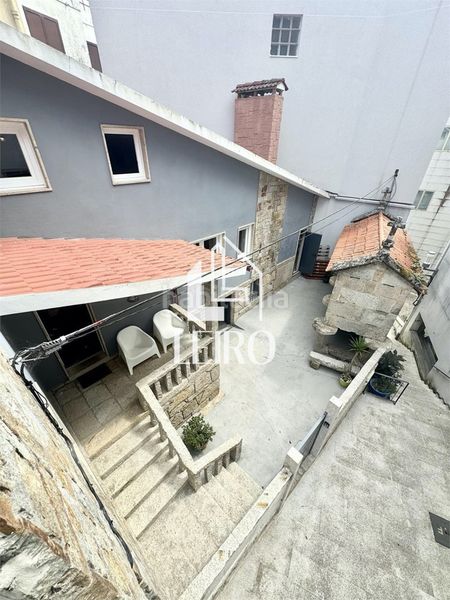 Foto ec7d2437-42e0-4de5-88ff-d06ec9b797ed. Casa amb xemeneia calefacció a Adina - Portonovo Sanxenxo