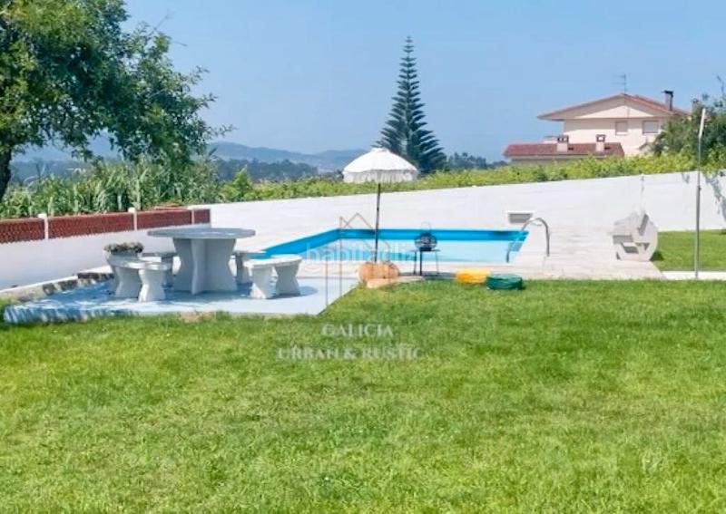 Foto c19efad8-54dd-42bd-a3af-d8b51712af00. Casa  con piscina para entrar a vivir en Camos Nigrán