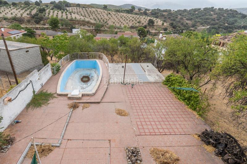 Foto 162aa38c-e5a7-4b77-8563-eb768e71414b. Chalet en camino de la barrera (far) 58 el Fargue 2000 metros de parcela segregable con chalet de 178m en tres plantas mas nave de 90 metros en Granada