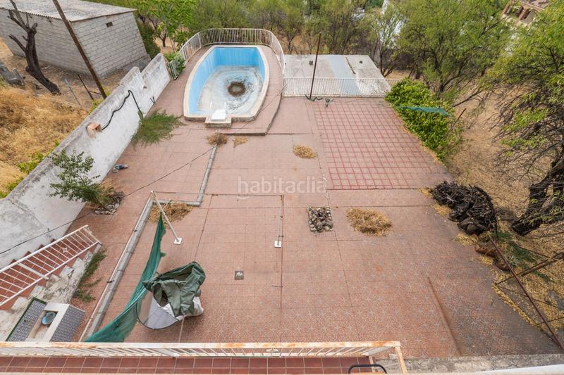 Foto 2f3a87a6-8d0d-45d8-84c0-650e4a5b1b9a. Chalet en camino de la barrera (far) 58 el Fargue 2000 metros de parcela segregable con chalet de 178m en tres plantas mas nave de 90 metros en Granada