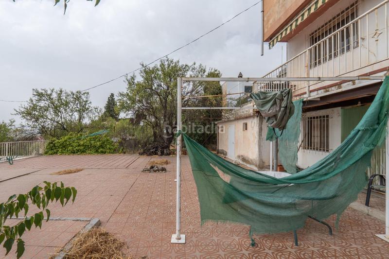 Foto 5ee10b54-94e9-46a7-8d1a-8397903640f8. Chalet en camino de la barrera (far) 58 el Fargue 2000 metros de parcela segregable con chalet de 178m en tres plantas mas nave de 90 metros en Granada
