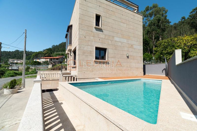 Foto b409bcf3-e512-4831-8de6-7e4e8cc1ce36. Casa amb calefacció aparcament piscina a Moaña